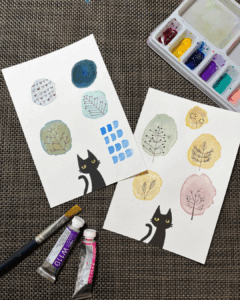 あべのハルカスのハンドメイドイベントで展示されている、手作りポストカードと北欧風イラストの写真。